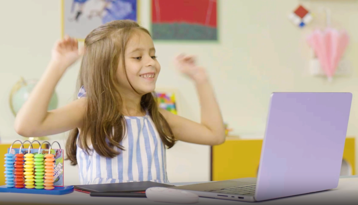 A student enjoying her online math class.